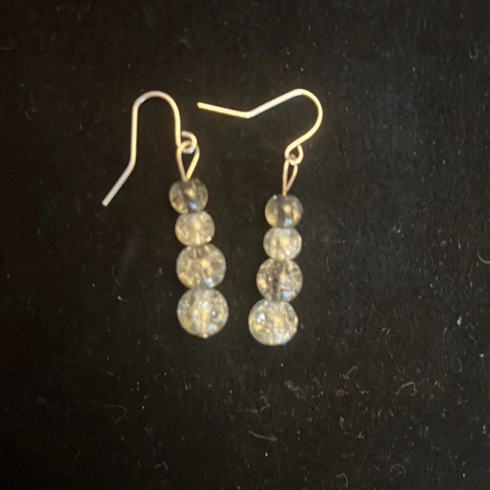 Handcrafted silver tone and glass bead earrings.